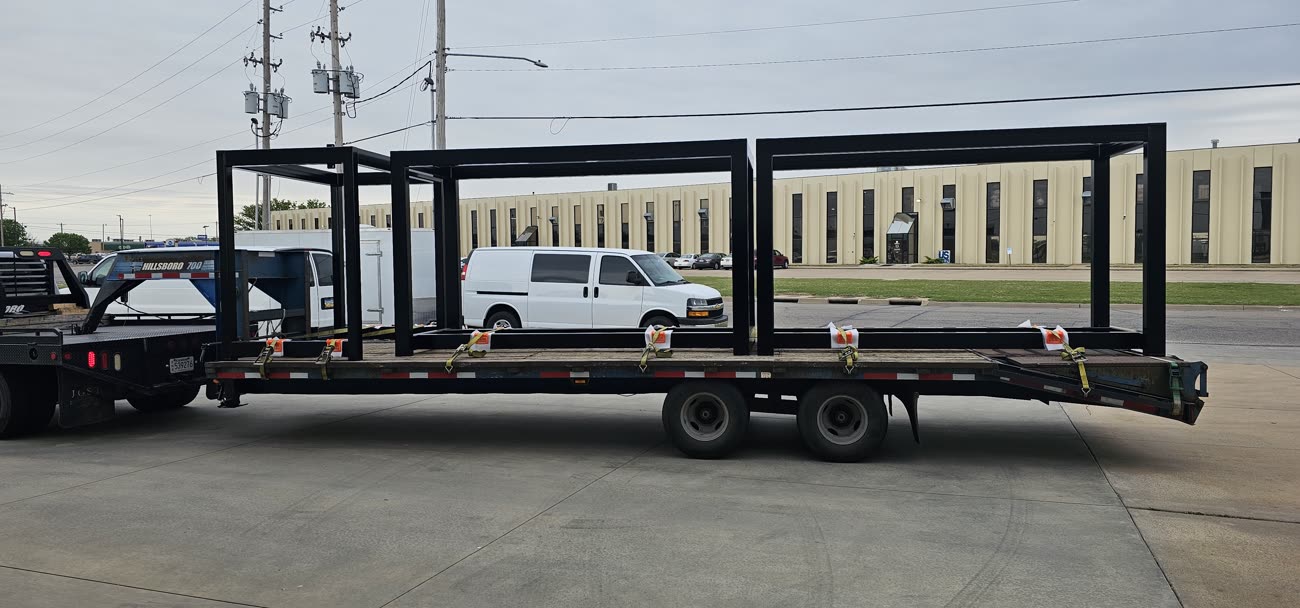 Welded structural steel machine frame staged for delivery