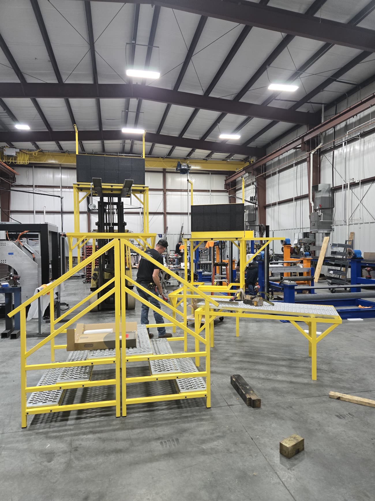 Elevated work platform and mezzanine with guardrails